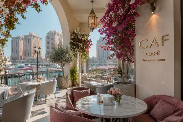 CAF Cafe - The Pearl Qatarfeaturing elegant pink interiors, floral decor, and a trendy Instagram-worthy atmosphere.