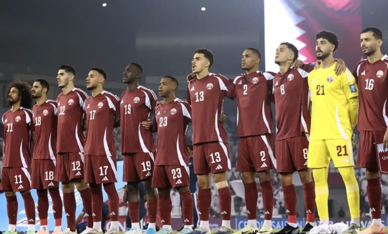 Qatar national football team players standing together before a FIFA World Cup match